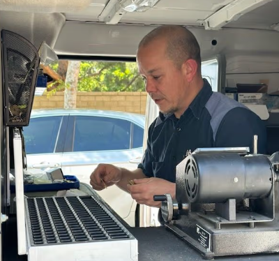 Joe Joe's locksmith technician working in service vehicle